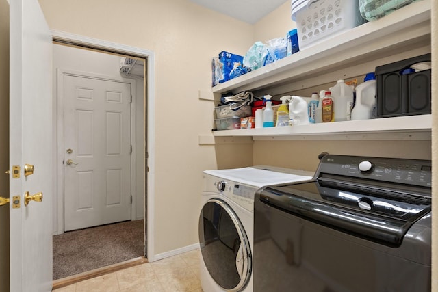 10335 Dunbar St NW, Albuquerque, NM 87114 - laundry room featuring washing machine and clothes dryer, light carpet, baseboards, laundry area, and light tile patterned floors
