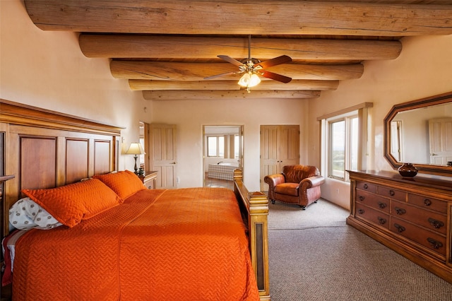 67A Blue Canyon Trl, Santa Fe, NM 87507 - bedroom featuring carpet floors, beam ceiling, ensuite bath, and ceiling fan