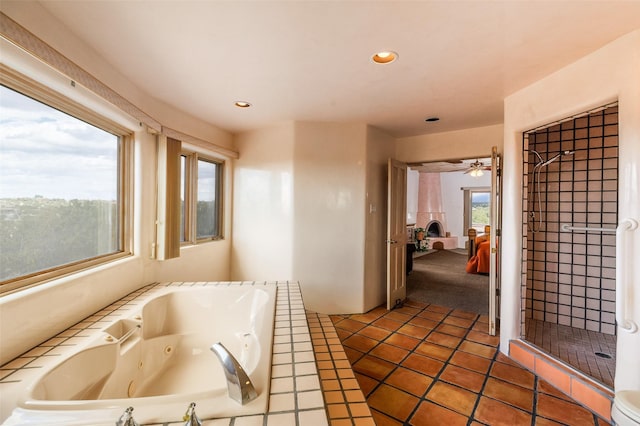 ensuite bathroom with recessed lighting, a whirlpool tub, a shower stall, and connected bathroom
