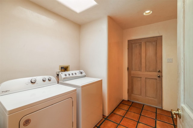 washroom with recessed lighting, washer and clothes dryer, laundry area, and light tile patterned floors
