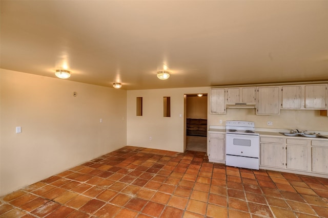 kitchen with under cabinet range hood, white electric stove, light countertops, and a sink