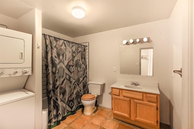 full bathroom with tile patterned floors, vanity, stacked washer / dryer, shower / tub combo with curtain, and toilet