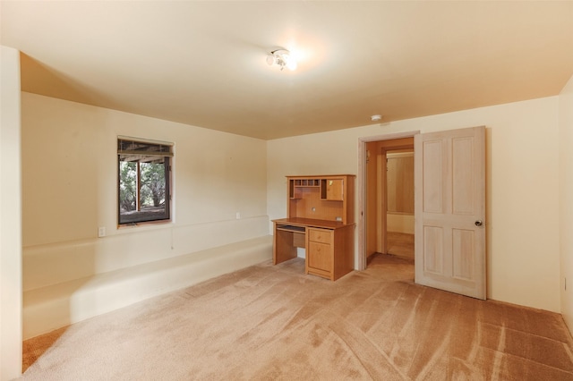 interior space featuring light carpet