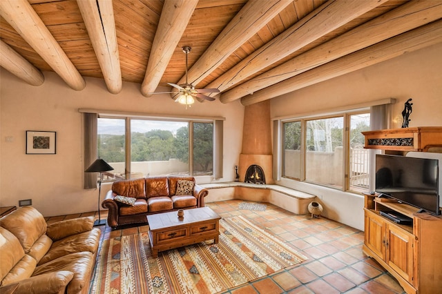 living room with beamed ceiling, tile patterned floors, wooden ceiling, and a healthy amount of sunlight