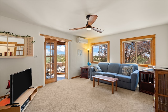 carpeted living area with a wall mounted air conditioner and a ceiling fan