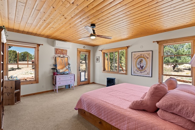 bedroom featuring wood ceiling, carpet floors, multiple windows, and access to exterior