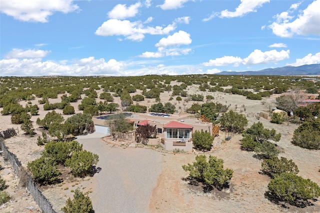birds eye view of property featuring a desert view and a mountain view