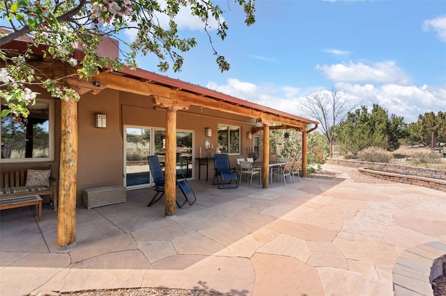 view of patio with outdoor dining space