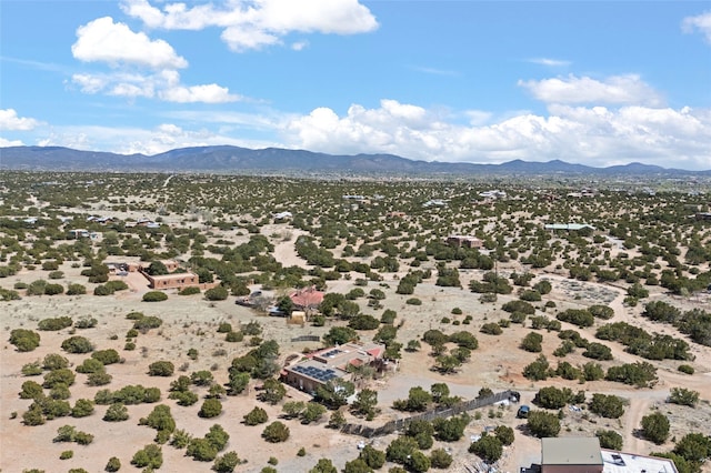 birds eye view of property with a mountain view and a desert view