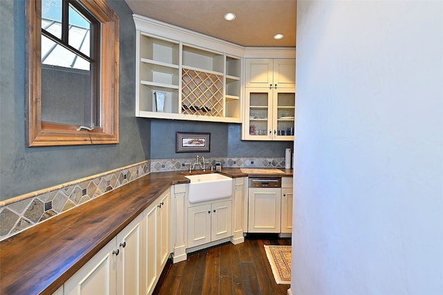 kitchen featuring recessed lighting, dark wood-style floors, open shelves, a sink, and butcher block countertops