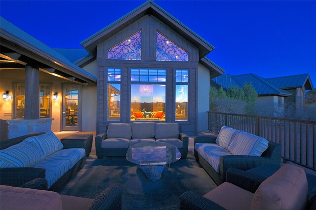 patio at twilight with an outdoor living space