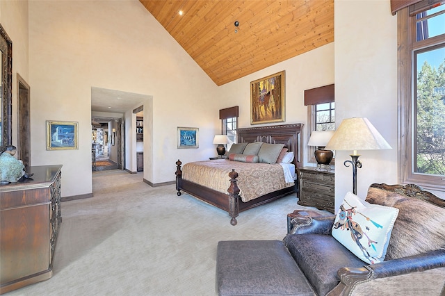 carpeted bedroom with high vaulted ceiling, wood ceiling, and baseboards