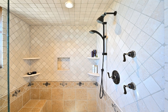 full bath featuring tiled shower