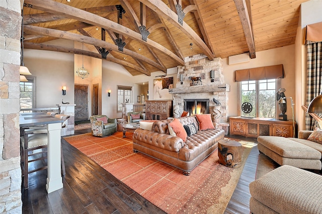 living room with wooden ceiling, beam ceiling, a fireplace, hardwood / wood-style flooring, and high vaulted ceiling