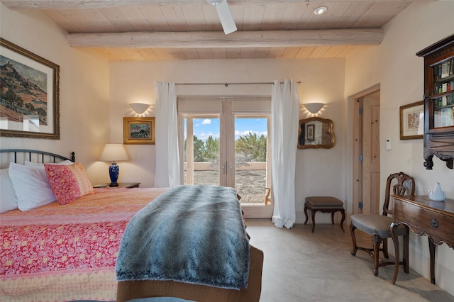 bedroom featuring access to exterior, carpet flooring, wooden ceiling, and beam ceiling