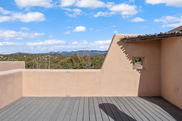 wooden deck featuring a mountain view