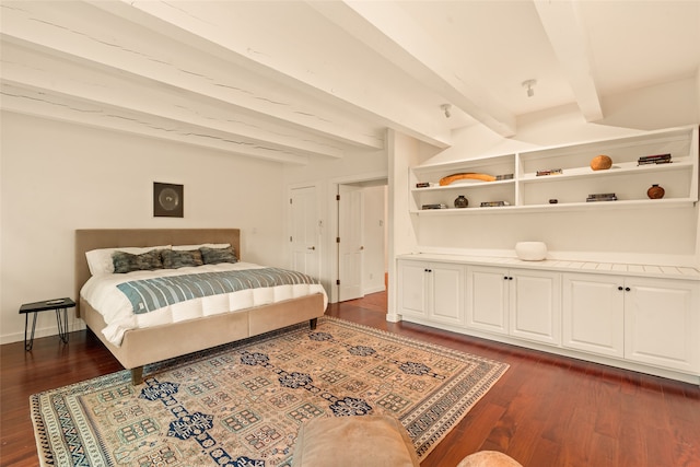 bedroom featuring beamed ceiling, baseboards, and dark wood-style floors