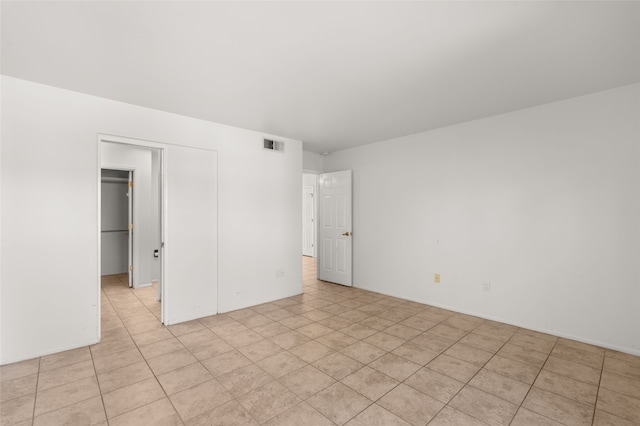 interior space featuring visible vents, a closet, and light tile patterned floors