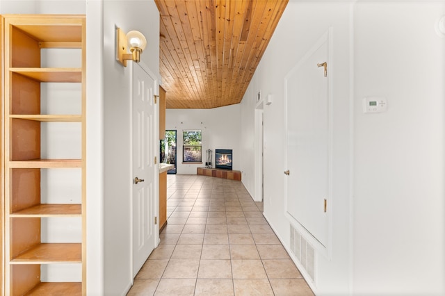 corridor with wooden ceiling, visible vents, and light tile patterned flooring