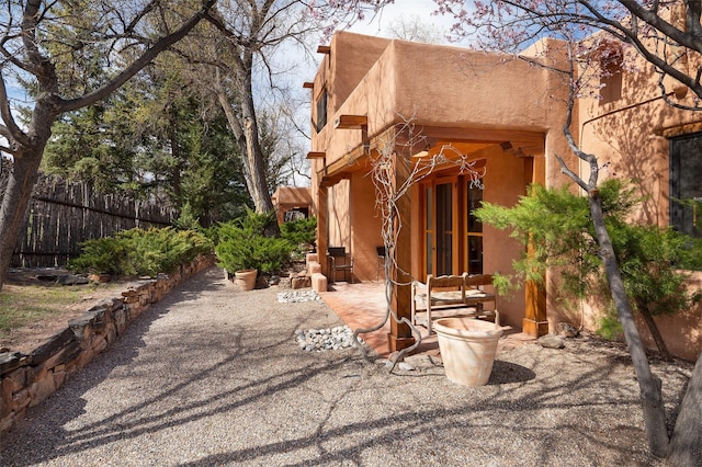 6 El Nido Ln, Santa Fe, NM 87506 - exterior space featuring fence, french doors, and a patio