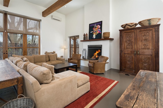 6 El Nido Ln, Santa Fe, NM 87506 - living room with a high ceiling, a wall unit AC, beam ceiling, a lit fireplace, and finished concrete floors