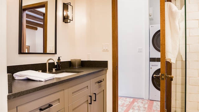 6 El Nido Ln, Santa Fe, NM 87506 - full bathroom featuring stacked washer / drying machine and vanity