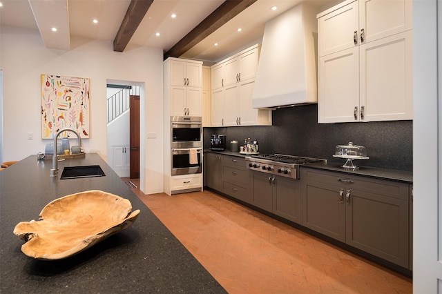 6 El Nido Ln, Santa Fe, NM 87506 - kitchen with recessed lighting, a sink, beamed ceiling, appliances with stainless steel finishes, and custom exhaust hood