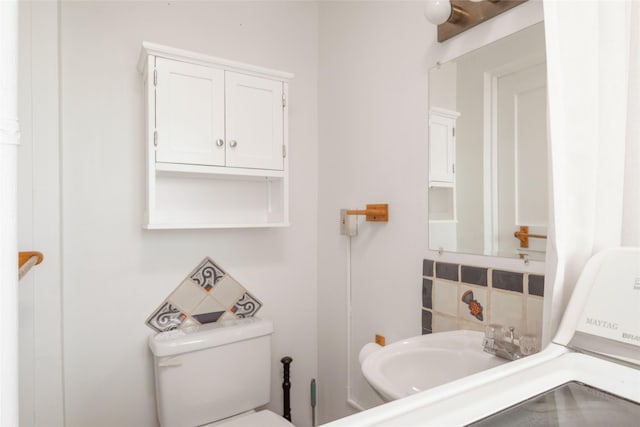 bathroom featuring toilet