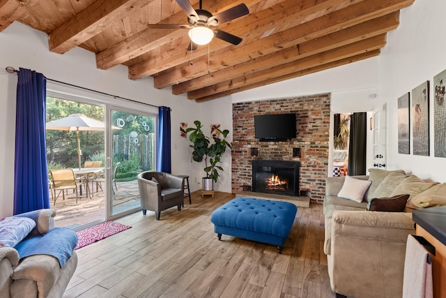 7689 Old Santa Fe Trl Unit C, Santa Fe, NM 87505 - living room with light wood finished floors, ceiling fan, wood ceiling, a brick fireplace, and lofted ceiling with beams