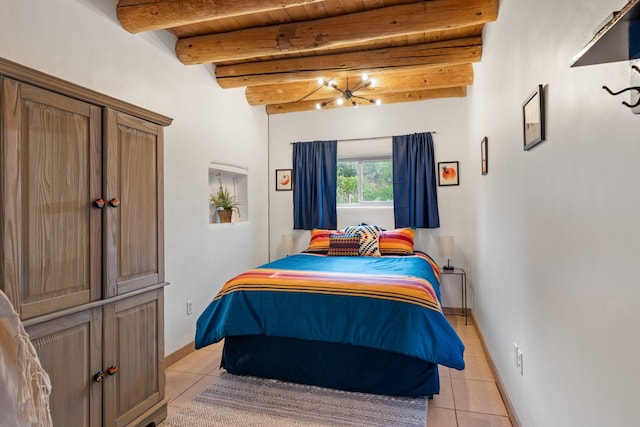 7689 Old Santa Fe Trl Unit C, Santa Fe, NM 87505 - bedroom with wooden ceiling, light tile patterned flooring, beamed ceiling, and baseboards