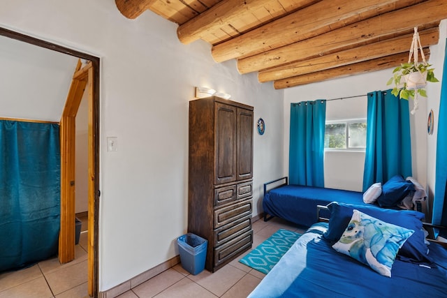 7689 Old Santa Fe Trl Unit C, Santa Fe, NM 87505 - bedroom with wood ceiling, light tile patterned floors, and beam ceiling