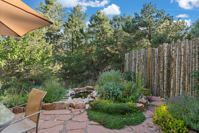7689 Old Santa Fe Trl Unit C, Santa Fe, NM 87505 - view of yard with a patio area and fence