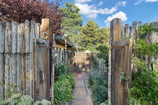7689 Old Santa Fe Trl Unit C, Santa Fe, NM 87505 - exterior space with a gate and fence