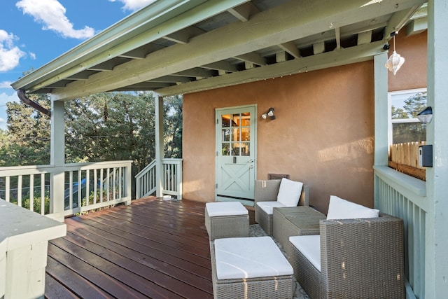 7689 Old Santa Fe Trl Unit C, Santa Fe, NM 87505 - wooden deck with outdoor lounge area