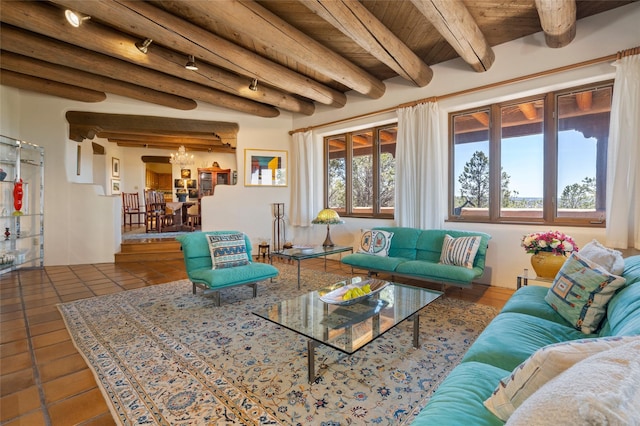 tiled living area with beamed ceiling, a chandelier, and wooden ceiling