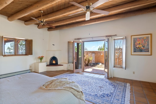bedroom featuring tile patterned floors, wood ceiling, beamed ceiling, a fireplace, and access to exterior