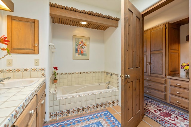 bathroom featuring a bath, vanity, and tile patterned floors