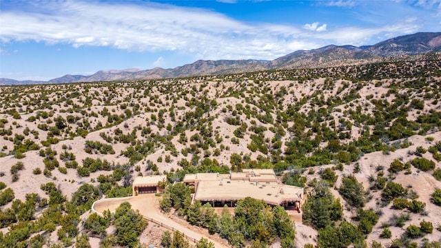aerial view featuring a mountain view, a desert view, and a rural view