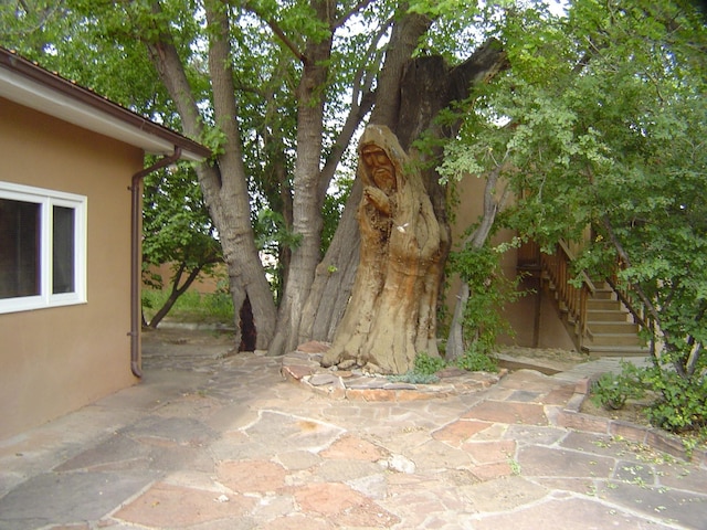view of patio / terrace featuring stairs