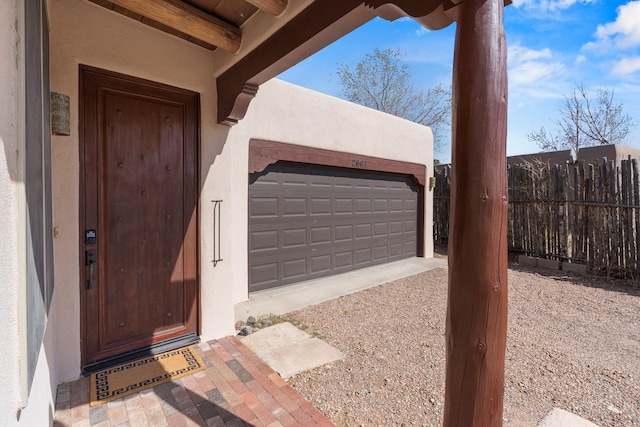 garage with fence