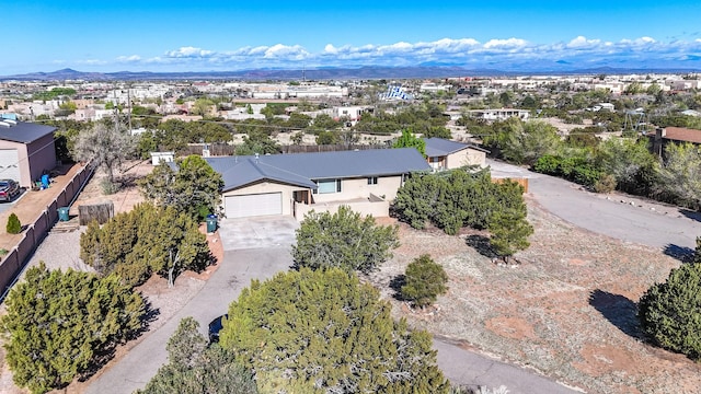 birds eye view of property with a mountain view