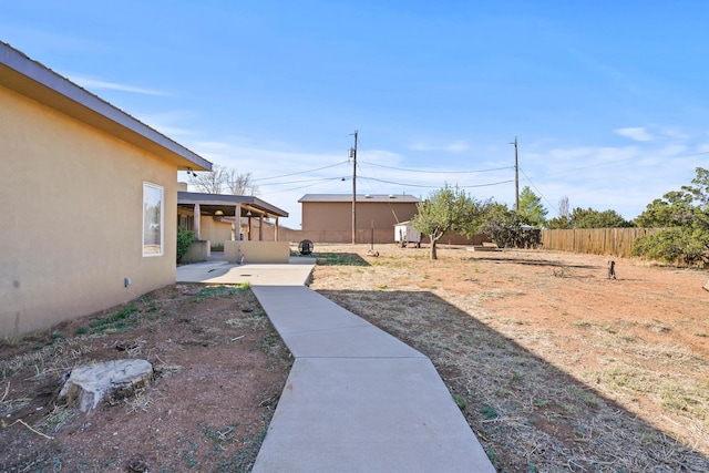 view of yard with a patio area and fence