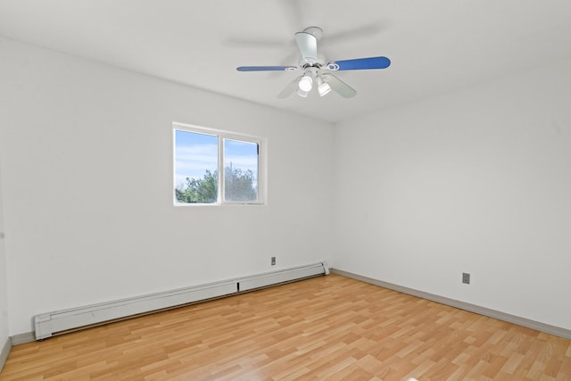 empty room with light wood-style floors, baseboards, baseboard heating, and ceiling fan
