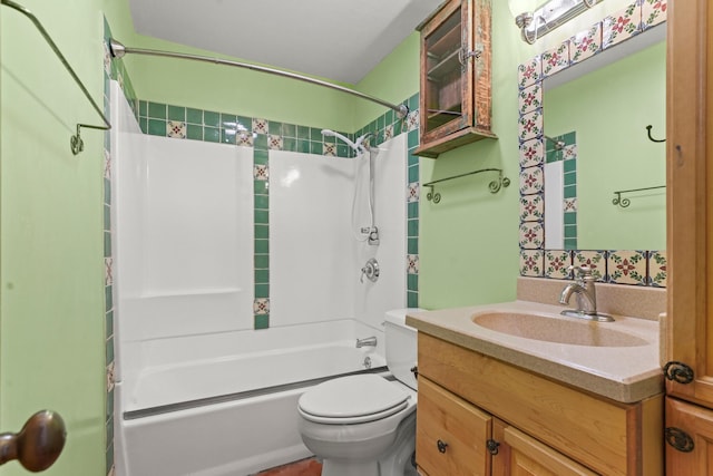 bathroom with toilet, vanity, and bathing tub / shower combination