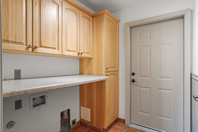 laundry room with light tile patterned floors, hookup for a washing machine, hookup for an electric dryer, and cabinet space