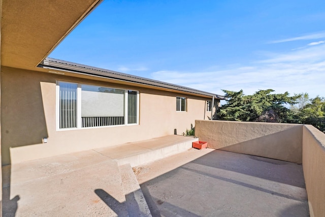 view of property exterior with stucco siding