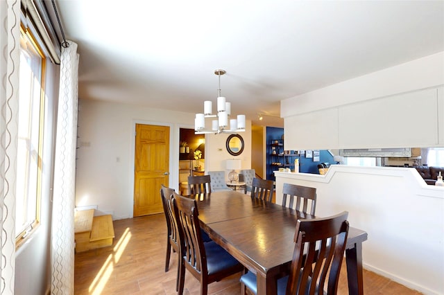 4715 Quemazon, Los Alamos, NM 87544 - dining area with light wood finished floors and a notable chandelier