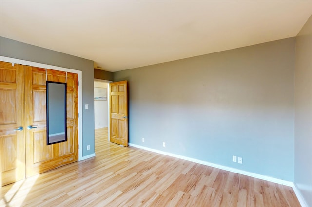 4715 Quemazon, Los Alamos, NM 87544 - unfurnished bedroom featuring baseboards, light wood finished floors, and a closet