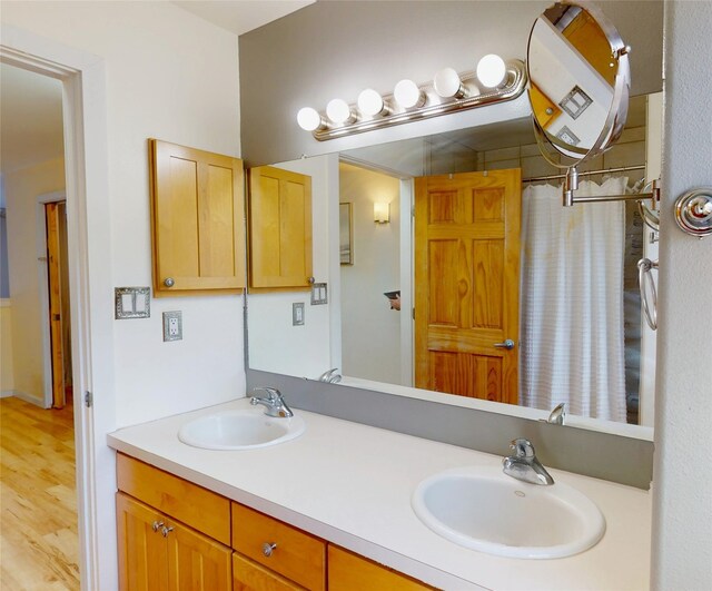 4715 Quemazon, Los Alamos, NM 87544 - full bathroom featuring double vanity, wood finished floors, and a sink