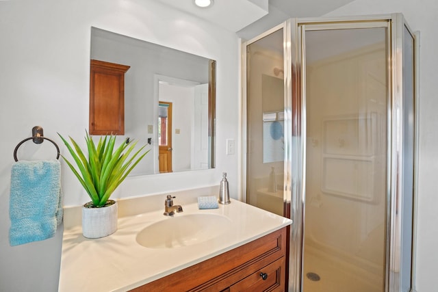 full bathroom featuring vanity and a stall shower